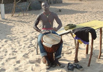 Playing Drums on Beach in the Gambia