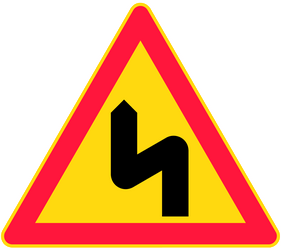 Double curve ahead, to the left then to the right - Road Sign