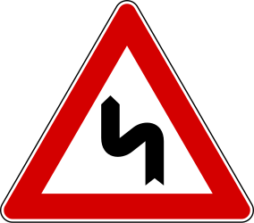Double curve ahead, to the left then to the right - Road Sign